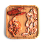 Load image into Gallery viewer, Seafood on a wooden square plate

