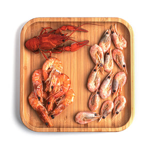 Seafood on a wooden square plate